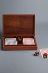 A wood box containing 2 decks of standard cards and 5 die.