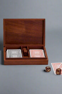 A wood box containing 2 decks of standard cards and 5 die.