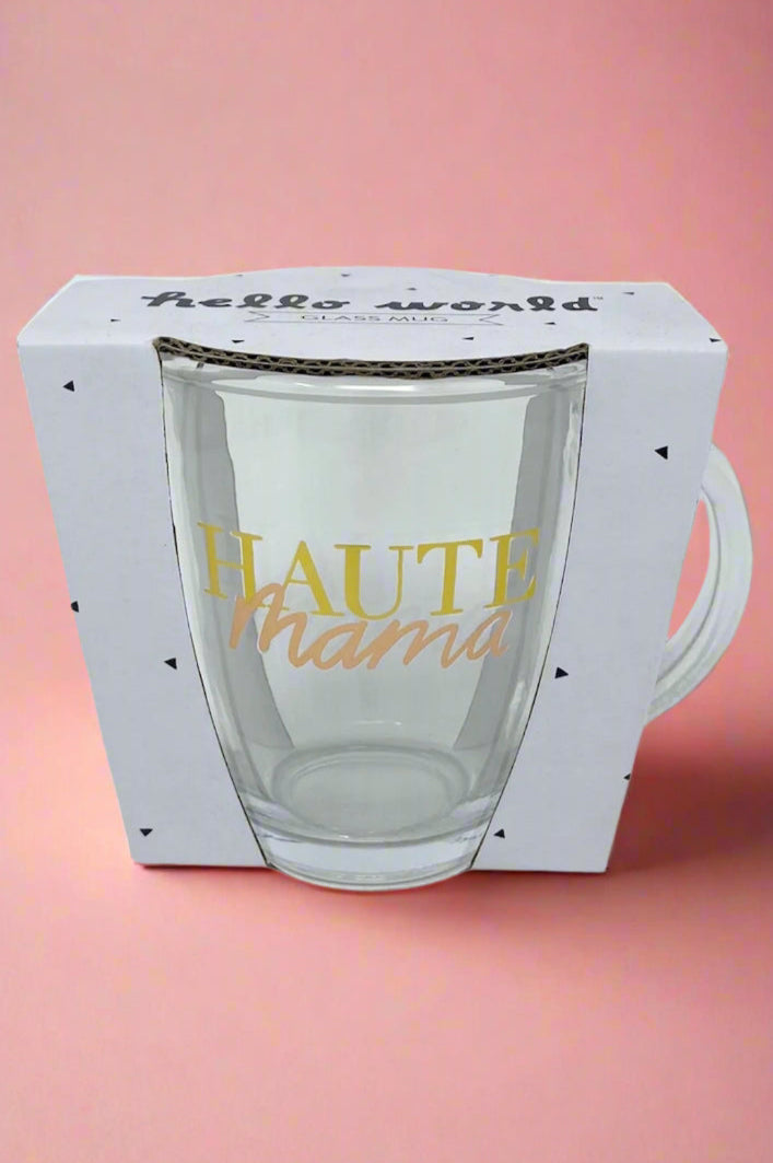 A clear glass coffee mug that says ‘Haute Mama’ in metallic print.
