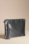 A satin grey clutch that includes wristlet and crossbody straps. It has a zip closure and is lined.