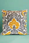 A square grey and yellow pattern throw pillow.
