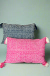 These flamingo or indigo throw pillows feature an intricate pattern and two-tone tassels. They are 100% cotton.