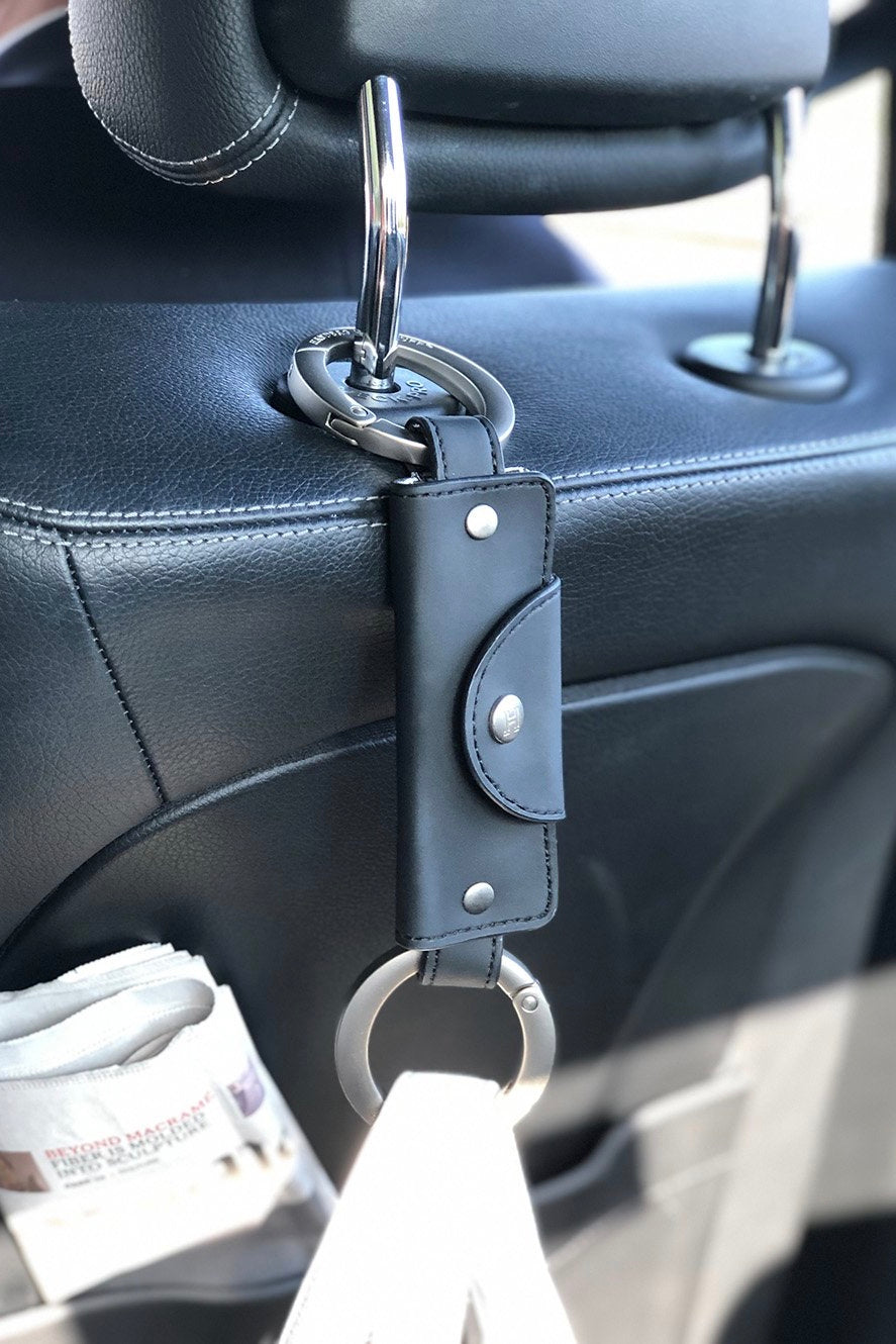 A cuff that attaches to anything, allowing you to hang your purse. Comes in different colors.