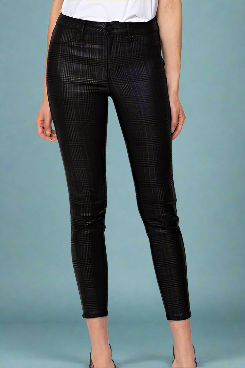 A pair of women’s skinny pants in black with a subtle shimmer plaid pattern.