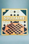 An image of Solitaire. Set contains wooden board, 33 wooden balls, and instructions.